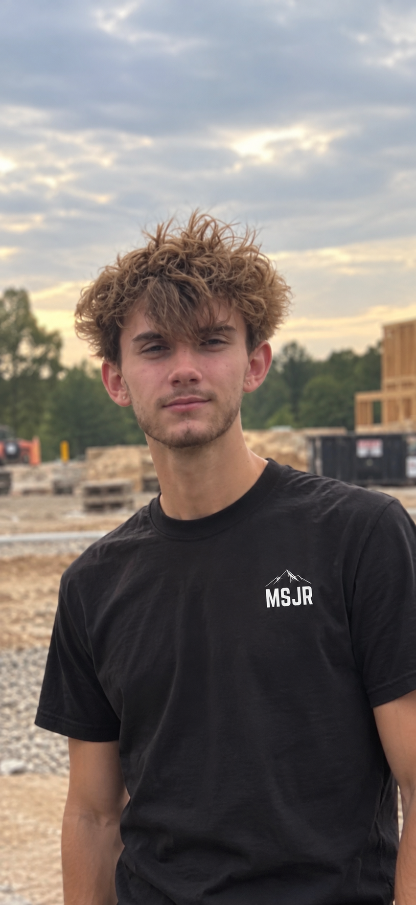 Paul Marley of Mountain State Junk Removal wearing an MSJR shirt on a job site